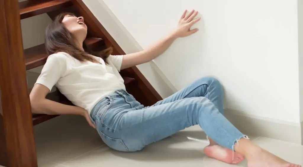 woman who experienced a slip and fall accident on stairs