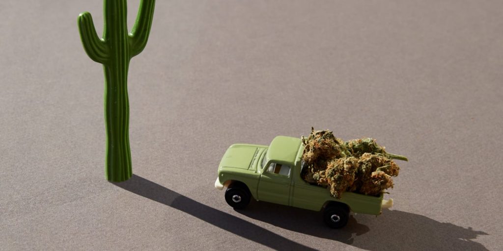 A toy car filled with cannabis to representing traveling with marijuana