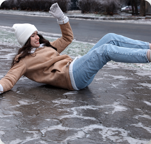 Woman falling on icy sidewalk illustrating slip and fall accident in Tucson, Arizona.