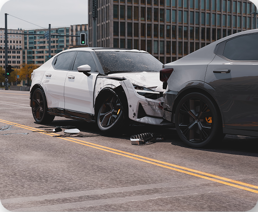 Damaged white car and gray car after collision, car accident legal representation in Tucson, Arizona.