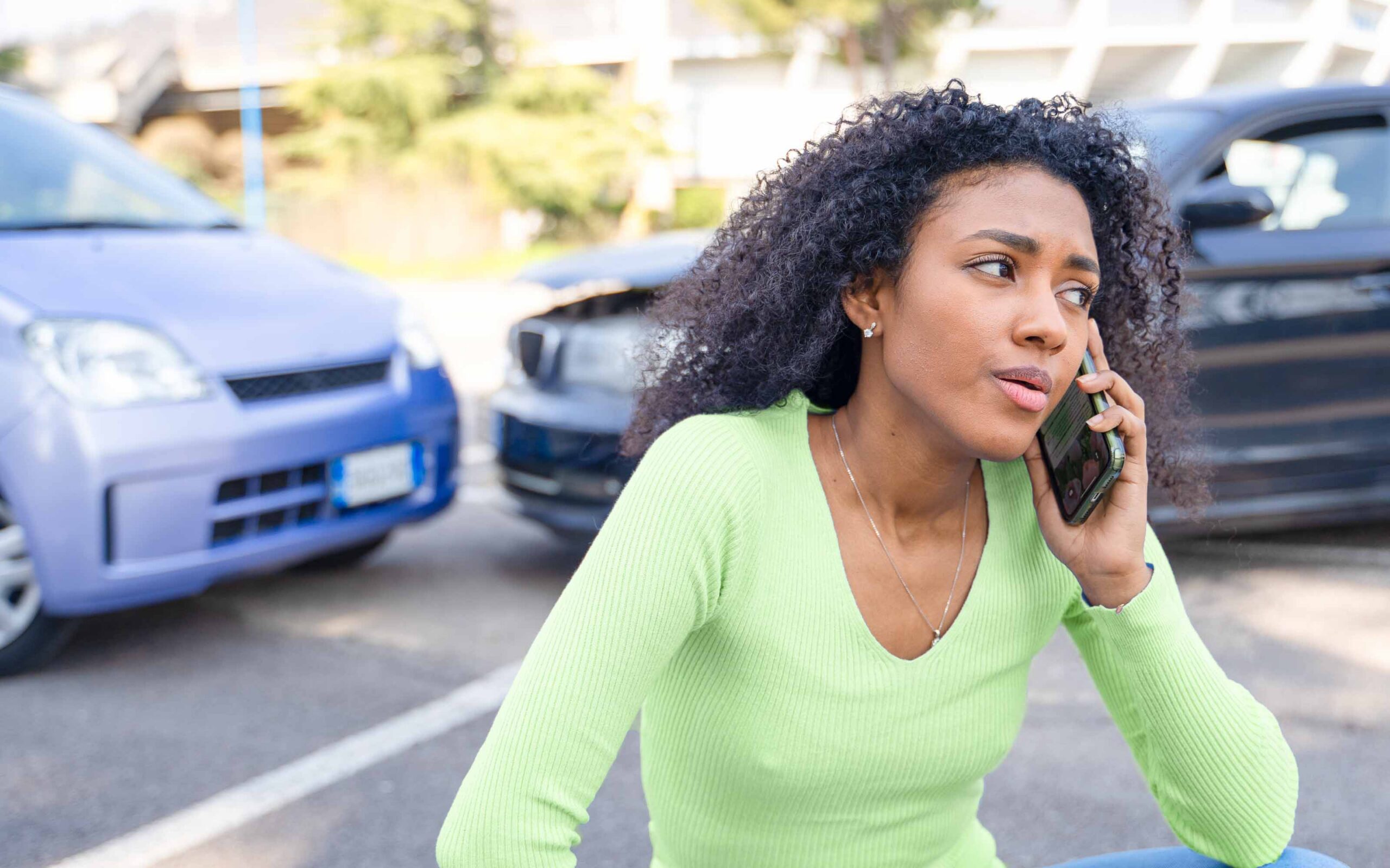 Woman calling her insurance company after an Arizona car accident