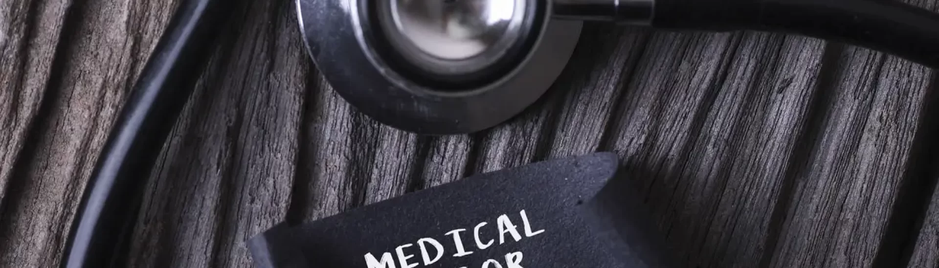 stethoscope near paper written medical error representing medical malpratice